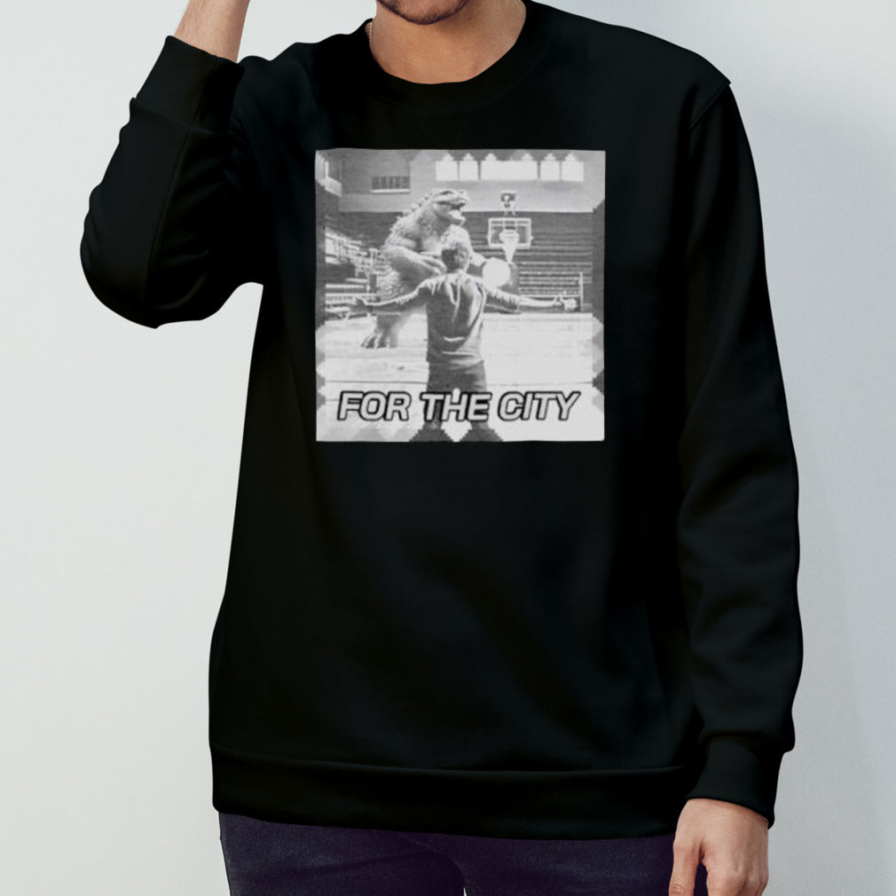 Godzilla playing basketball for the city shirts