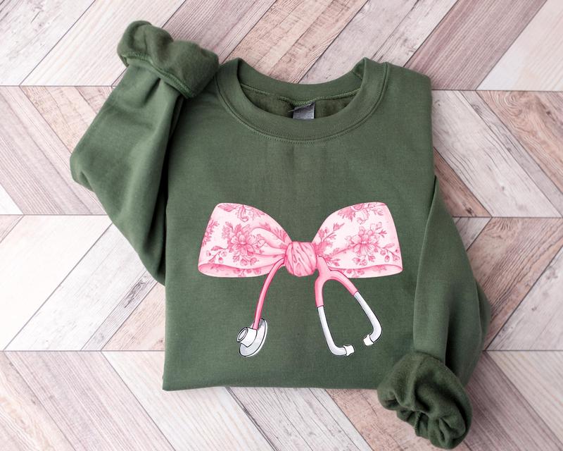 Pink Coquette Nurse Stethoscope Bow Sweatshirt, Gift for Nurse, Bow Oversized Shirt, Nurse Appreciation, Christmas Gift for Nurse, Pink Bow Sweater, G