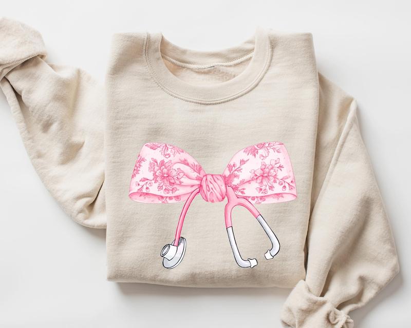 Pink Coquette Nurse Stethoscope Bow Sweatshirt, Gift for Nurse, Bow Oversized Shirt, Nurse Appreciation, Christmas Gift for Nurse, Pink Bow Sweater, G